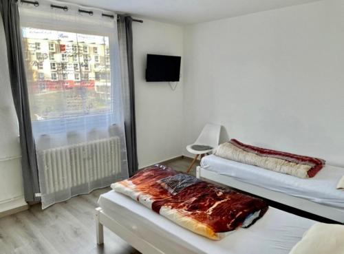 TV tai viihdekeskus majoituspaikassa Apartment für Monteure Nr 3