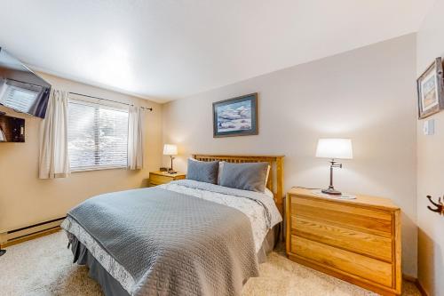 a bedroom with a bed and a window at Alpine Gem in Park City