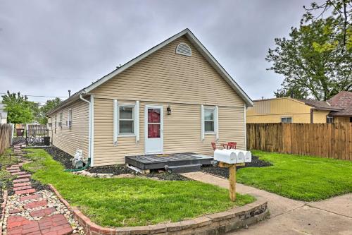 a house with a yard with a mailbox in front of it at Council Bluffs Cottage Proximity to Parks! in Council Bluffs