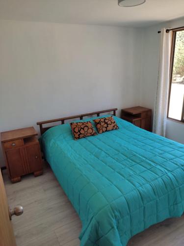 A bed or beds in a room at Cabañas VistaBosque de Algarrobo