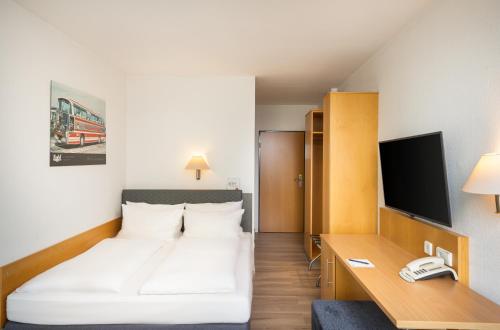Cama o camas de una habitación en Arthotel ANA Neotel