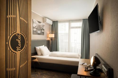 Cama o camas de una habitación en Arthotel ANA Neotel