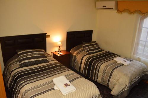 Postel nebo postele na pokoji v ubytování Hotel My House