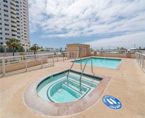 a swimming pool on the roof of a building at 2 Bed Ocean View Balconys Corner Unit LB Convention Center in Long Beach