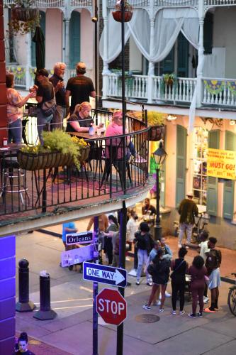 a group of people walking on a city street at Bourbon Orleans Hotel in New Orleans