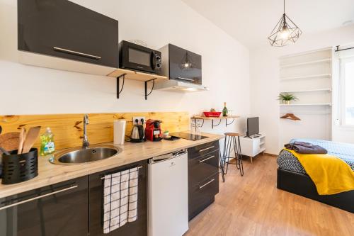 Η κουζίνα ή μικρή κουζίνα στο Cosy Apparts Brive