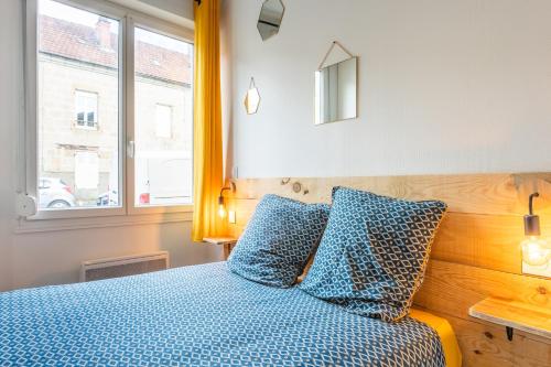 Ένα ή περισσότερα κρεβάτια σε δωμάτιο στο Cosy Apparts Brive