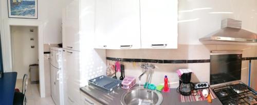 a kitchen with a sink and a counter top at Apartment Nicol in Pula