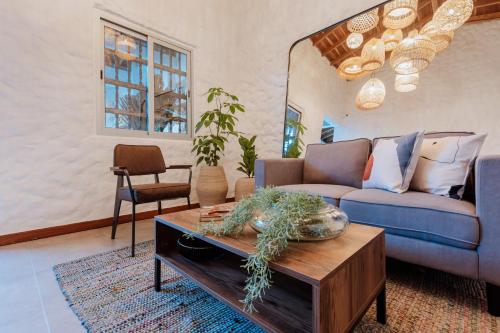 a living room with a couch and a table at La Casa de Nelly - Medellín in Medellín