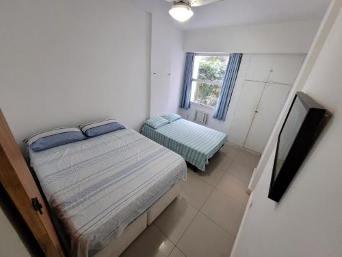 מיטה או מיטות בחדר ב-Apartments Almirante Goncalves