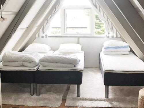 En eller flere senge i et værelse på Holiday Home Lagunenblick XI