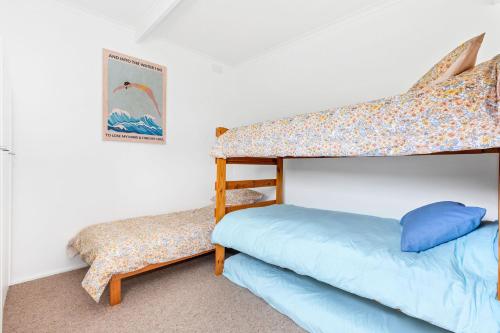 Postel nebo postele na pokoji v ubytování Tyrone Beach Escape