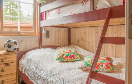 a bedroom with a bunk bed with a soccer ball at 3 Bedroom Amazing Home In Meråker in Meråker