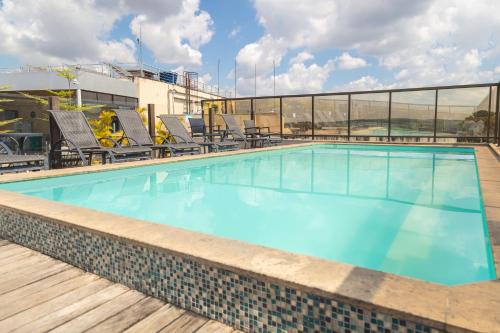 a swimming pool on the roof of a building at Lagoon Prime Hotel in Lagoa Santa