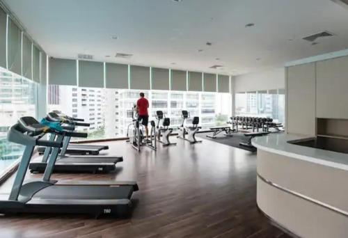 a gym with a man on a bike in a room at City Home Suites Kuala Lumpur City Centre in Kuala Lumpur
