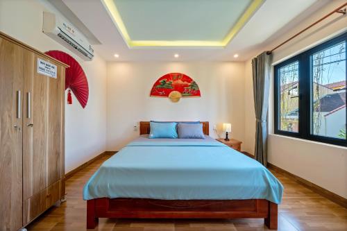 Postel nebo postele na pokoji v ubytování Nam Hội Homestay