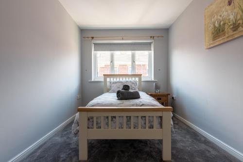 a small bedroom with a bed and a window at Number 4 in Bishop Auckland