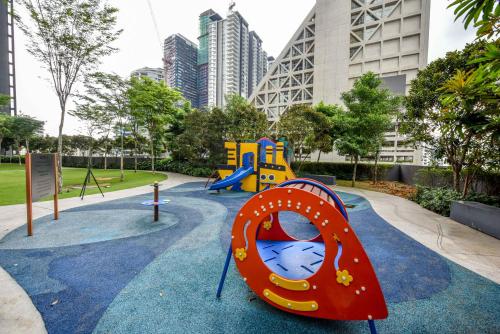 a playground in a park with a slide at Mcity at Jalan Ampang in Kuala Lumpur
