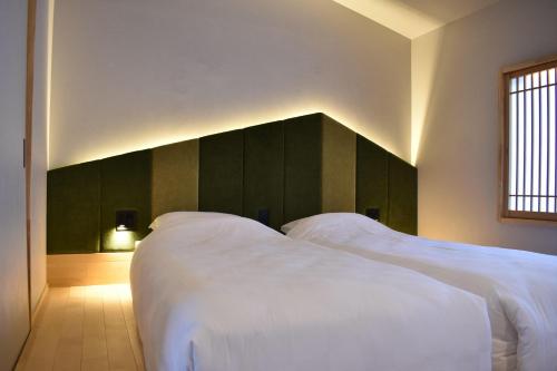 Ένα ή περισσότερα κρεβάτια σε δωμάτιο στο TABITABI KANOE MITSU