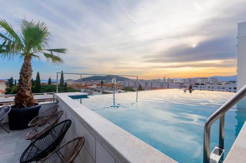 a swimming pool on the roof of a building at Art Hotel in Split