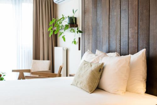 Een bed of bedden in een kamer bij Van Heeckeren Hotel