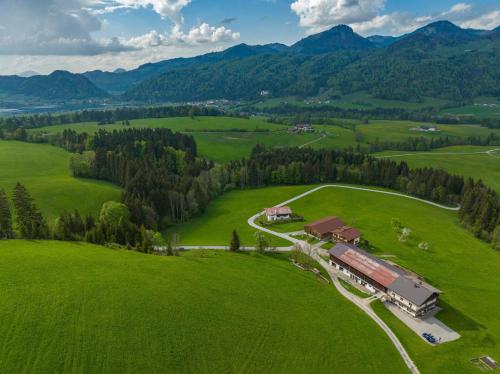 an aerial view of a farm in a green field at Zasserlhof Familie Bamberger in Kössen