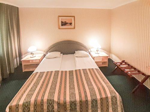 Łóżko lub łóżka w pokoju w obiekcie Villa Historia