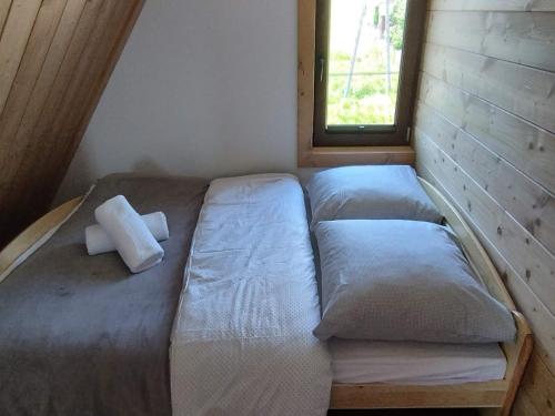Łóżko lub łóżka w pokoju w obiekcie Apartamenty u Bobaków