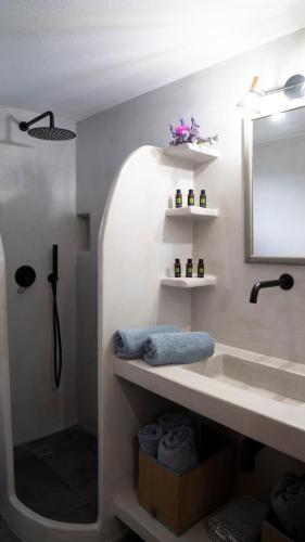 a bathroom with a sink and a mirror at Villa Stevi in Drios