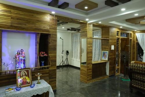 a room with a stage with a picture on it at Thodupuzha 4-bhk Luxury Home awy from home in Thodupuzha