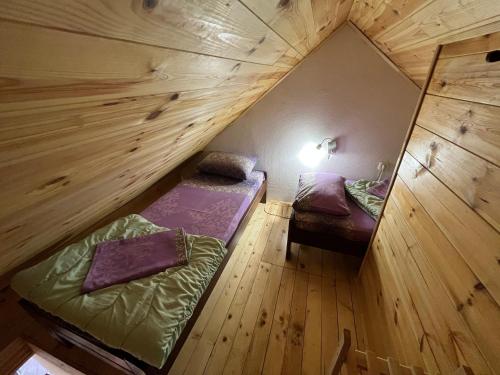 Postelja oz. postelje v sobi nastanitve Dormire Apartmans