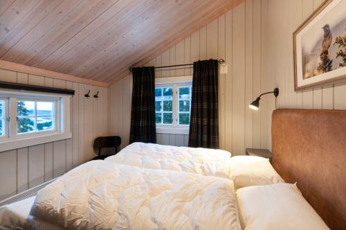 Säng eller sängar i ett rum på GudbrandsGard Hyttegrend Kvitfjell