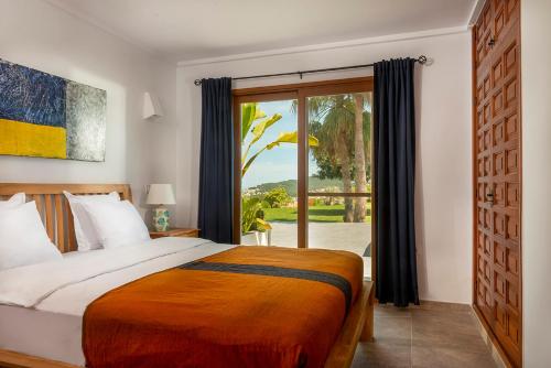 Giường trong phòng chung tại Villa Orlando by Aguilarent