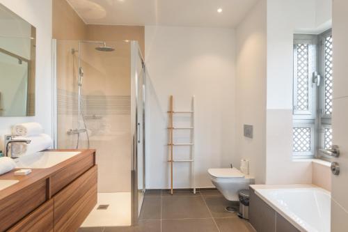 a bathroom with a sink and a toilet and a shower at Gazmira 21 DELUXE 2B in Palm-mar