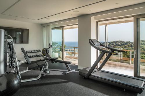 a gym with a view of the ocean at Four Seasons Astir Palace Hotel Athens in Athens