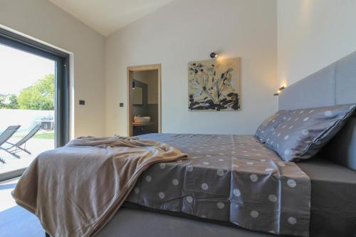 Postel nebo postele na pokoji v ubytování Modern villa with private pool in Pula