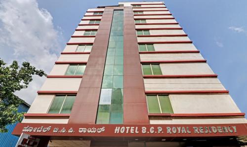 a tall building with a sign on it at Itsy By Treebo - BCP Suites in Bangalore