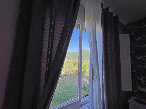 a window with a view of a mountain view at Tenuta delle Acque in Acquasparta