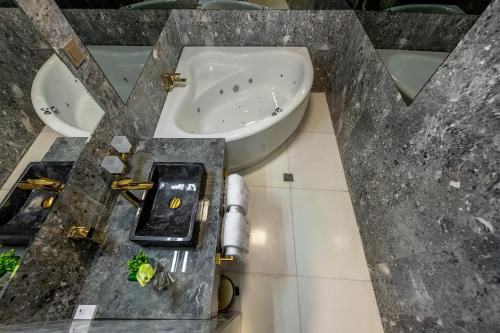 a bathroom with a sink and two sinks at St Palace Hotel in Vilnius