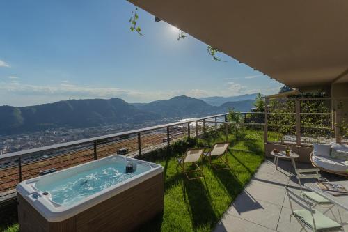 a hot tub on a balcony with a view at La Vista Bonita by Rent All Como in Como
