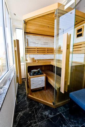 a room with a shower with a glass wall at Apartment Sun in Vir