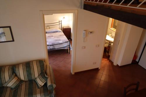 a view of a room with a bed and a hallway at Relais Cà Nova Guest House in Bogogno