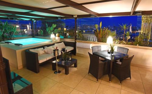 a living room with a swimming pool in a building at Suite Hotel Santa Chiara in Lecce