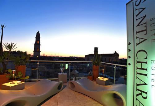 a view of a building with two pairs of shoes at Suite Hotel Santa Chiara in Lecce