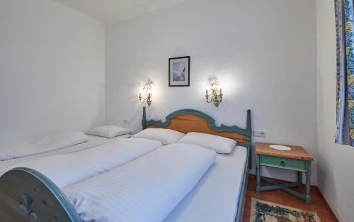 a group of four beds in a room at Chalet Haider in Saalbach Hinterglemm