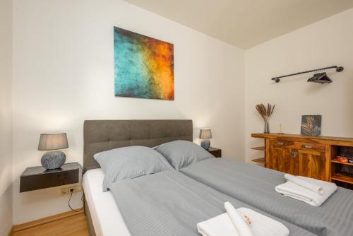 Postel nebo postele na pokoji v ubytování Arbio I Local Apart in Sudvorstadt