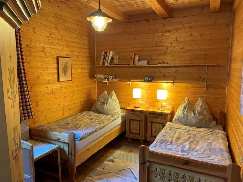 Cama ou camas em um quarto em Almhaus Hochrindl