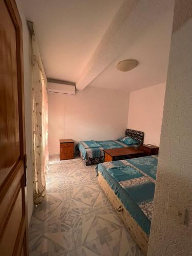 a room with two beds in a room at Villa Ajša in Bar