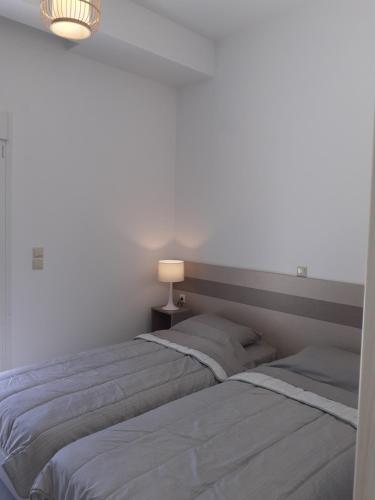 Postel nebo postele na pokoji v ubytování Villas Lago e Mare