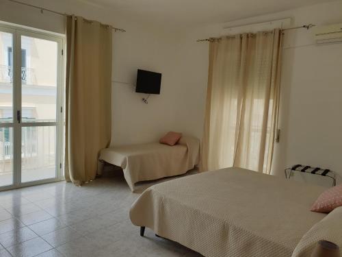 Кровать или кровати в номере Appartamenti in Centro a Vieste